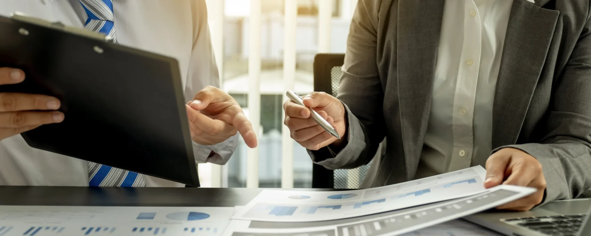 Advisors reviewing financial documents together